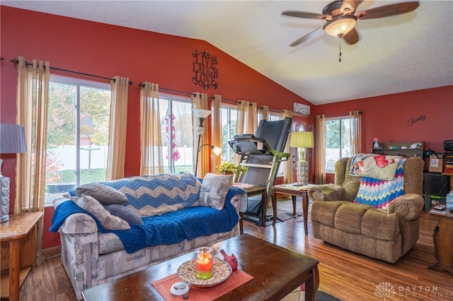 living room featuring hardwood / wood-style flooring, vaulted ceiling, and ceiling fan