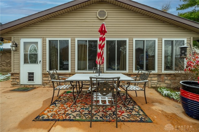 back of property with a patio area