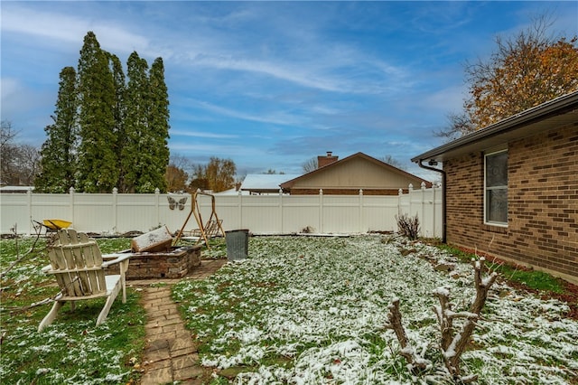 view of yard covered in snow