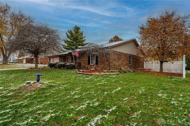 view of side of home featuring a yard