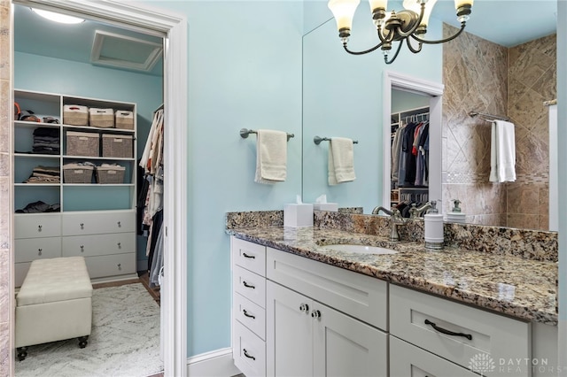 bathroom featuring vanity and an inviting chandelier