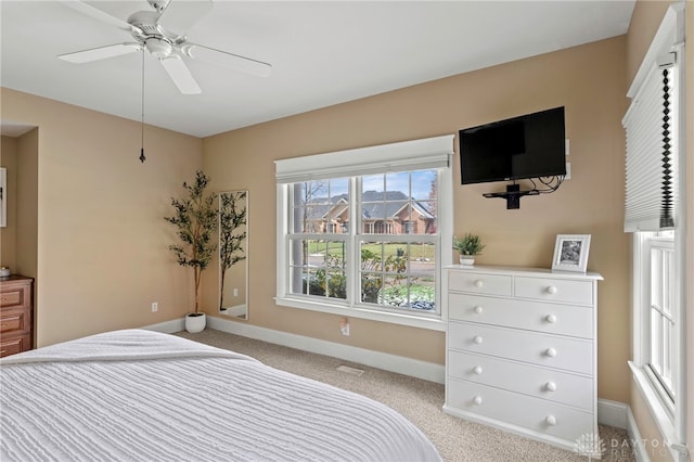 carpeted bedroom featuring ceiling fan