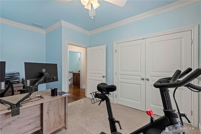 home office with light colored carpet, ceiling fan, and crown molding