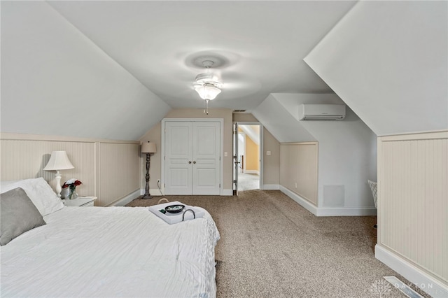 unfurnished bedroom featuring carpet, a wall mounted AC, wooden walls, ceiling fan, and lofted ceiling