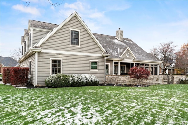 snow covered house with a yard