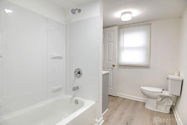 full bathroom with vanity, toilet, tub / shower combination, and wood-type flooring