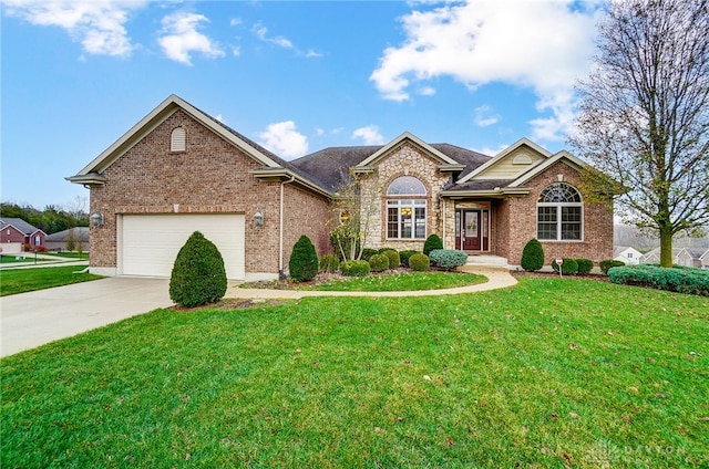 view of front of property with a garage and a front lawn