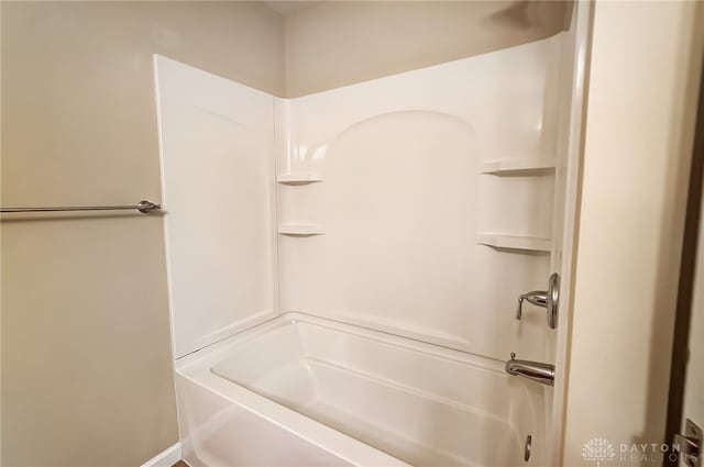 bathroom featuring washtub / shower combination