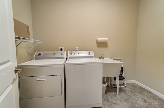 laundry room featuring independent washer and dryer and sink