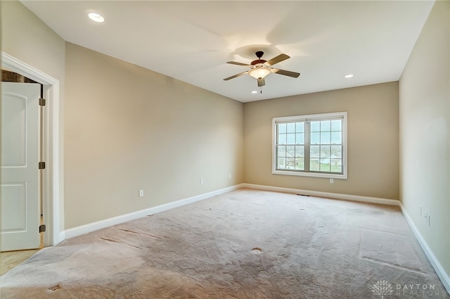 carpeted empty room featuring ceiling fan