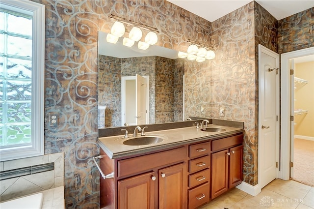 bathroom with tile patterned floors and vanity