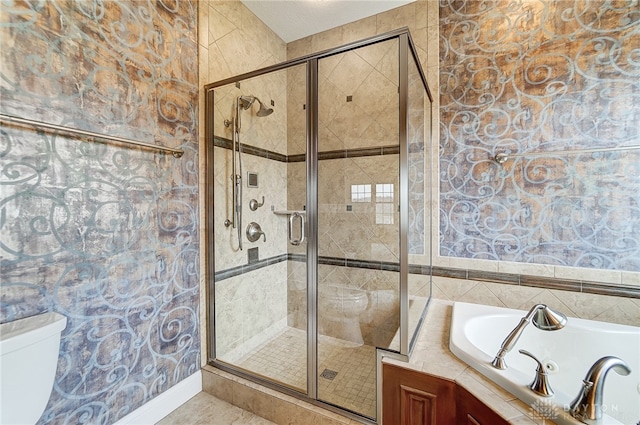 bathroom with separate shower and tub and toilet