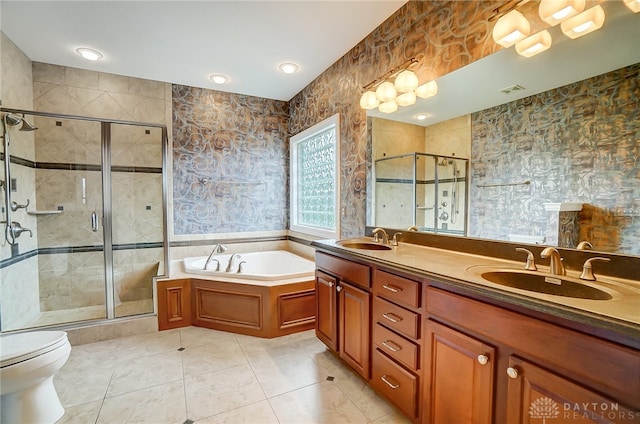 full bathroom featuring tile patterned floors, toilet, shower with separate bathtub, and tile walls