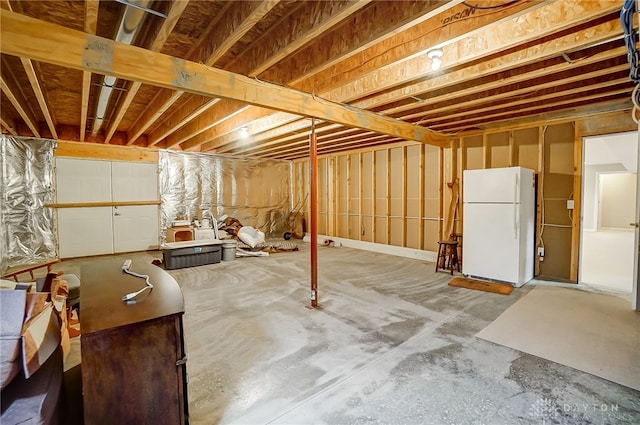 basement featuring white refrigerator