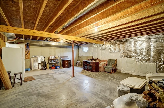 basement featuring white refrigerator