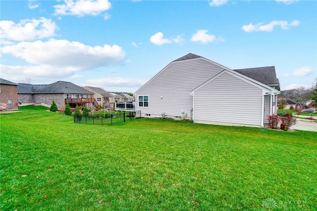 rear view of house with a lawn