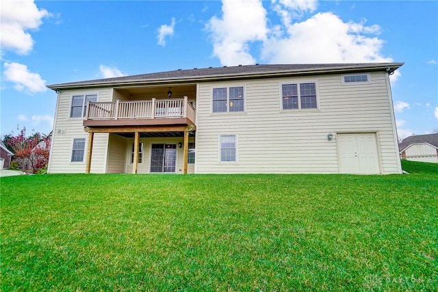 back of property with a yard and a wooden deck