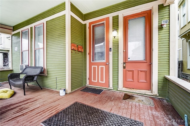 view of exterior entry featuring a porch