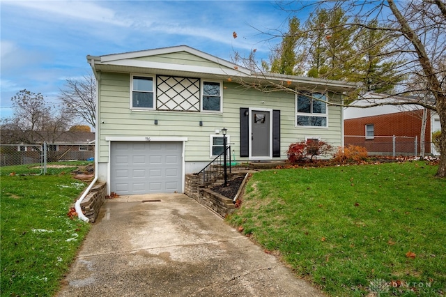 split foyer home with a front lawn and a garage