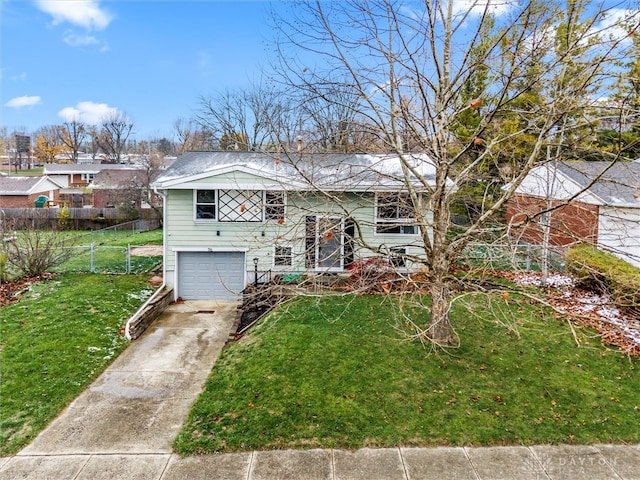 view of front of house with a garage and a front yard