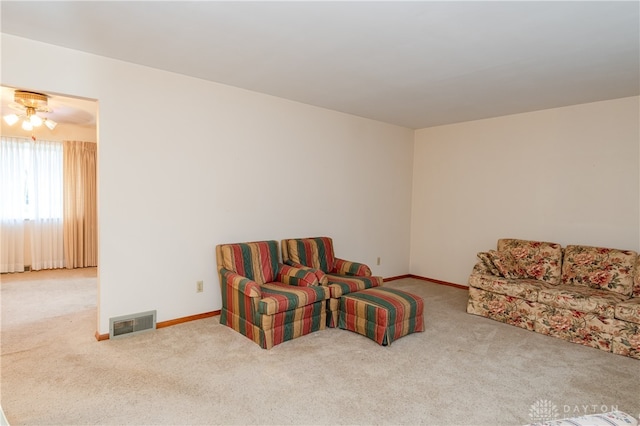 sitting room featuring carpet floors