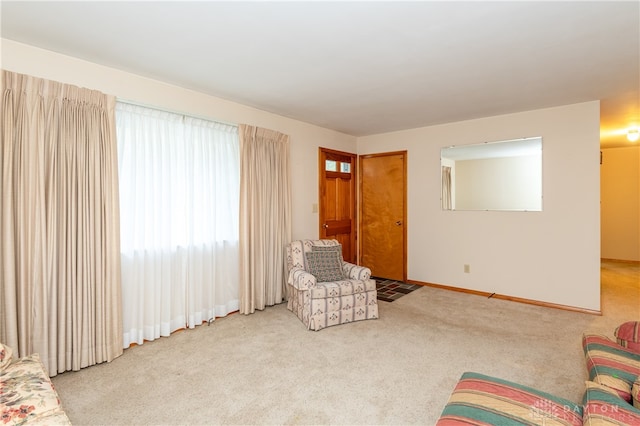 living area with light carpet