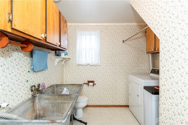 washroom featuring washer / clothes dryer, crown molding, and sink