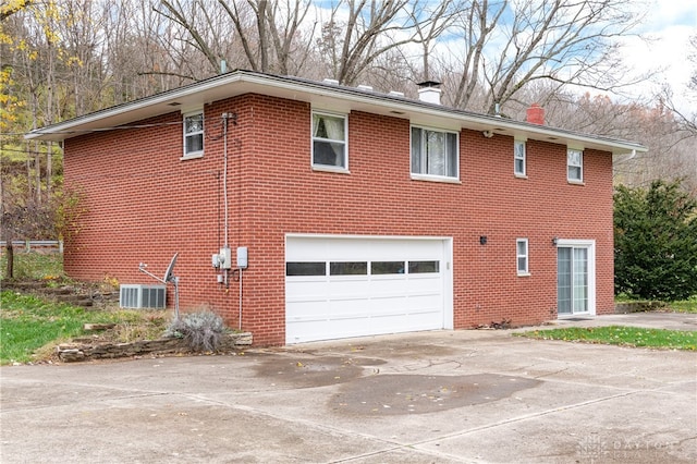 view of side of property with a garage