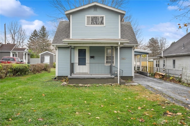 view of front facade with covered porch and a front lawn