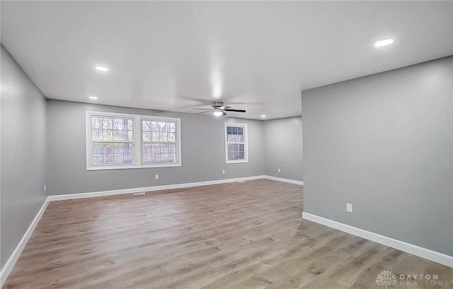 empty room featuring ceiling fan and light wood-type flooring