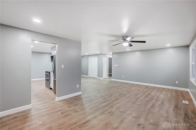 unfurnished living room featuring light hardwood / wood-style floors and ceiling fan