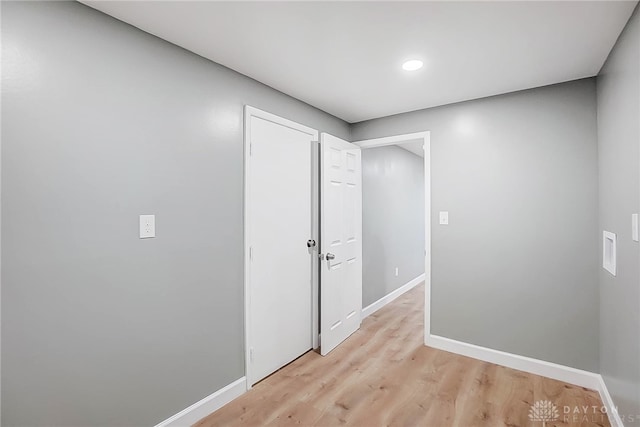 corridor featuring light hardwood / wood-style floors