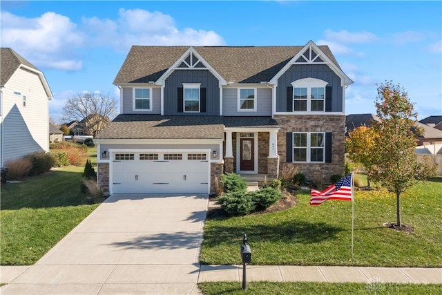 view of front of property with a front yard and a garage