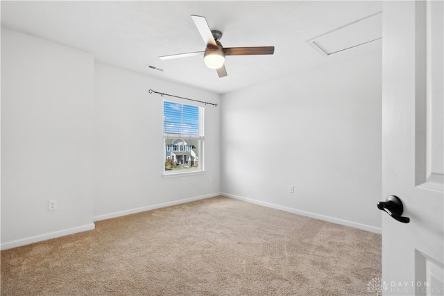 unfurnished room with ceiling fan and light colored carpet