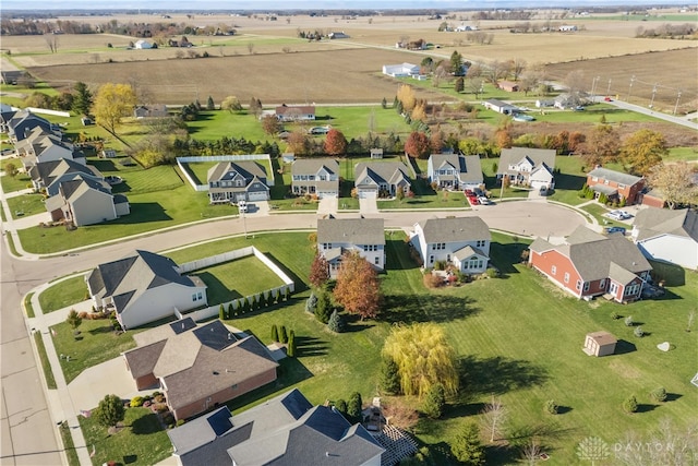 birds eye view of property with a rural view