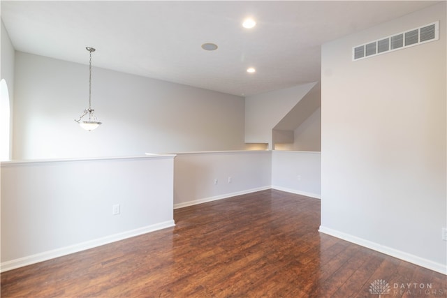 empty room featuring dark hardwood / wood-style flooring