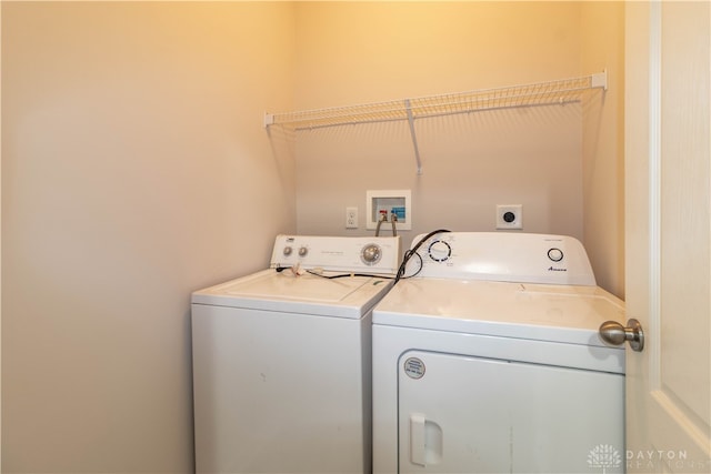 laundry area featuring washing machine and clothes dryer