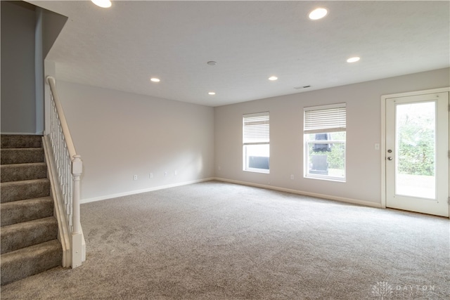 unfurnished living room featuring carpet floors