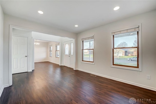 foyer featuring dark wood-type flooring