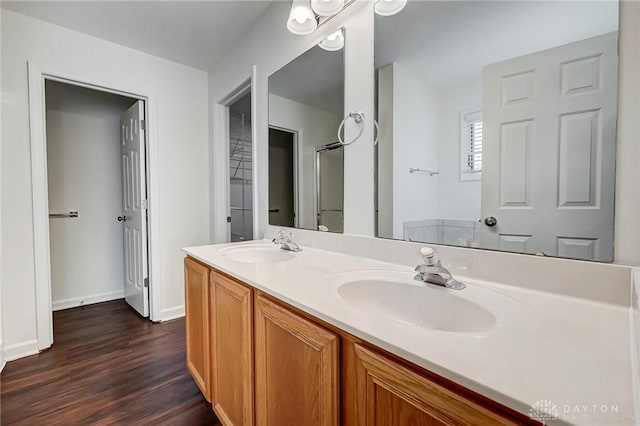 bathroom with vanity and hardwood / wood-style floors