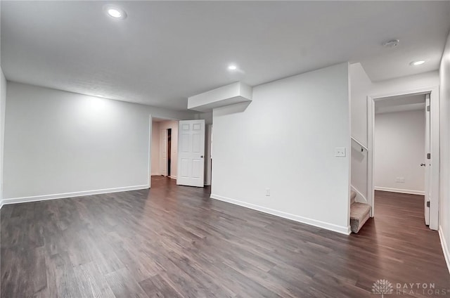 basement featuring dark hardwood / wood-style floors