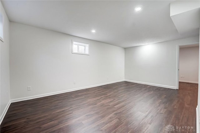 basement featuring dark hardwood / wood-style flooring