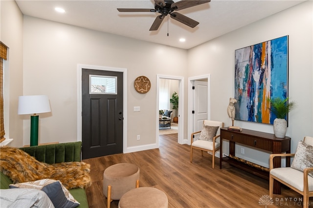 foyer entrance with hardwood / wood-style floors and ceiling fan