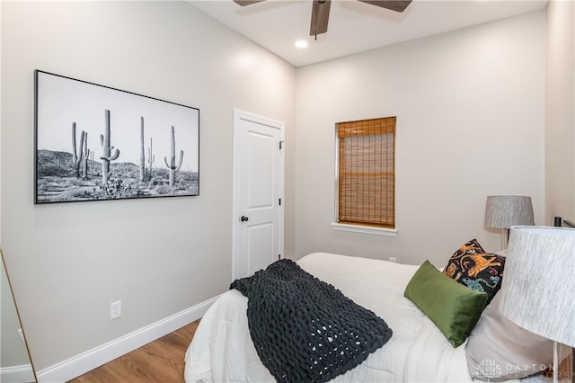 bedroom featuring hardwood / wood-style floors and ceiling fan