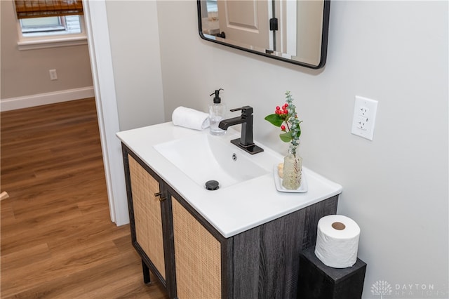 bathroom featuring wood-type flooring and vanity