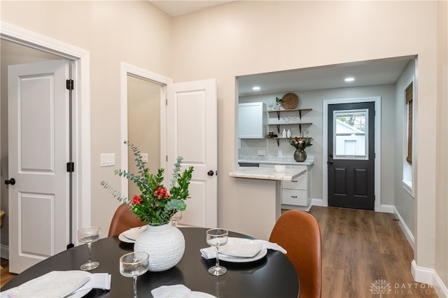 dining room with dark hardwood / wood-style flooring