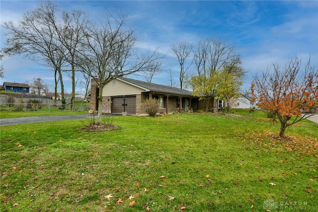 exterior space with a lawn and a garage