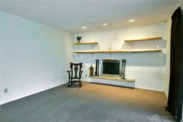 5331 Birchbend Ct, Dayton, OH 45415 - unfurnished room with carpet floors, recessed lighting, a brick fireplace, and brick wall