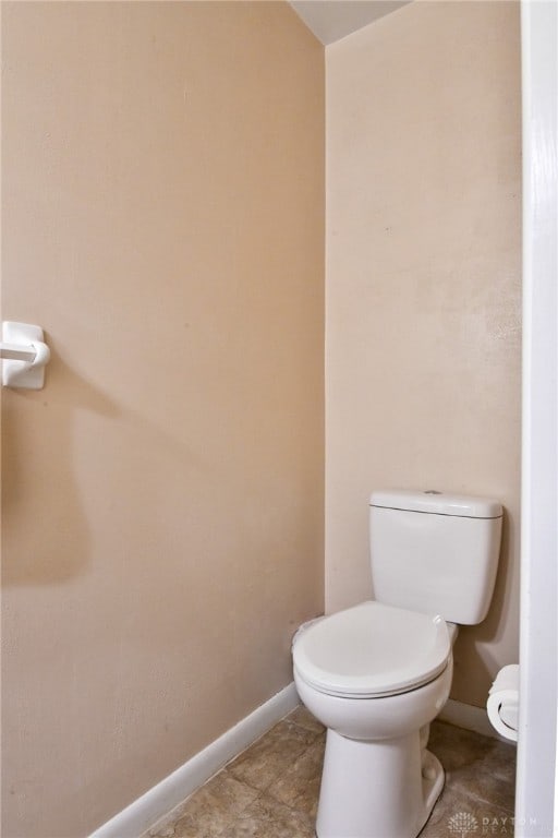 bathroom with tile patterned floors and toilet