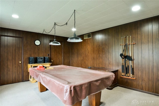 rec room featuring light colored carpet, wooden walls, and pool table